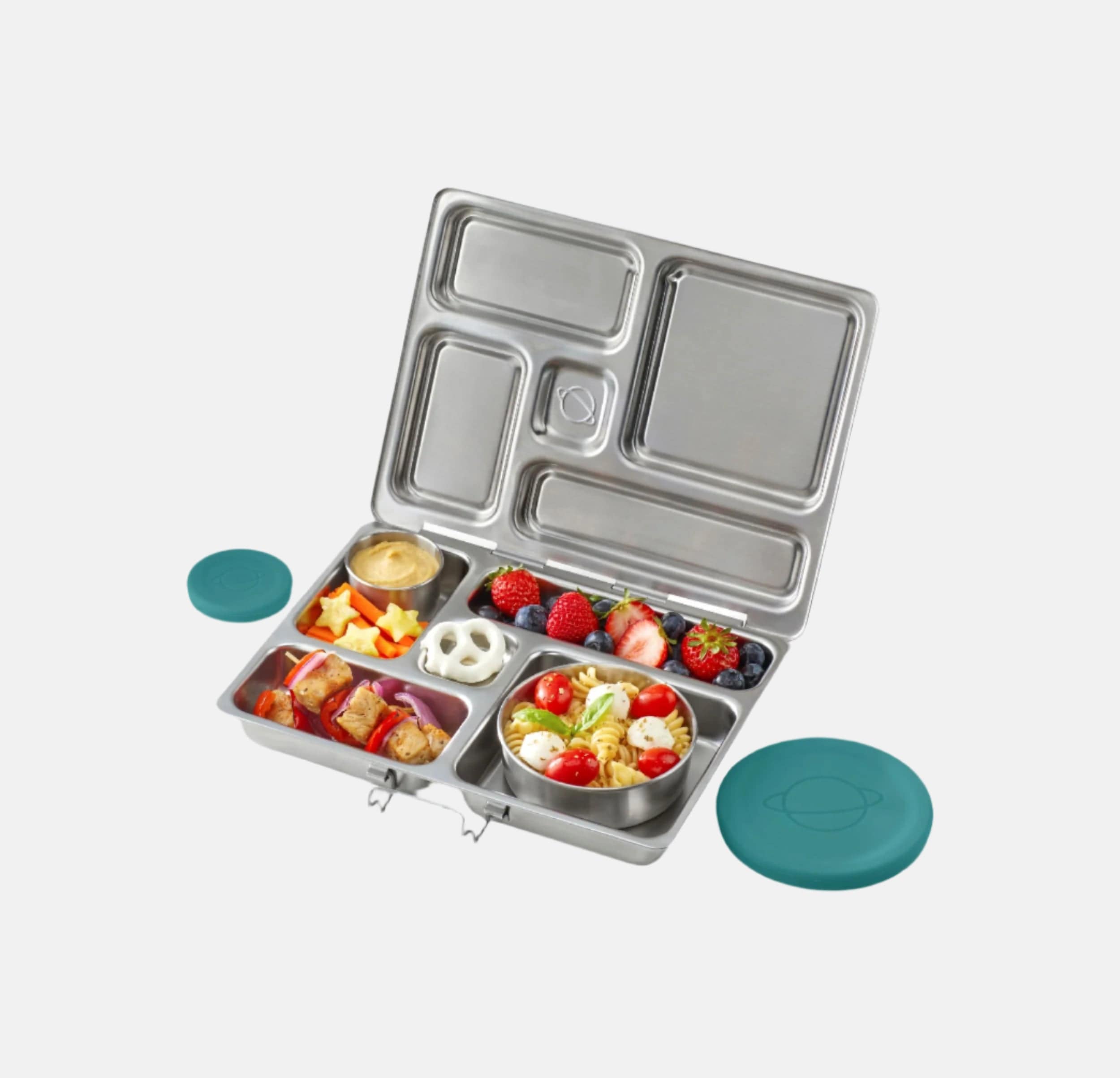 Stainless steel bento box with compartments filled with food on a white background