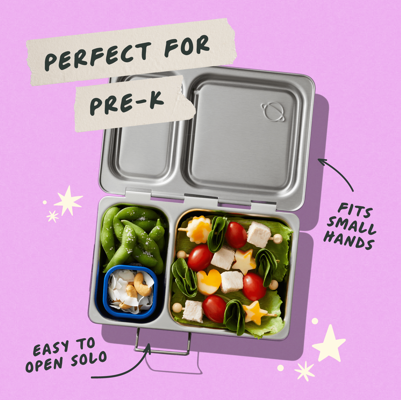 Shuttle lunchbox on pink background, filled with vegetable kebabs and edamame. 