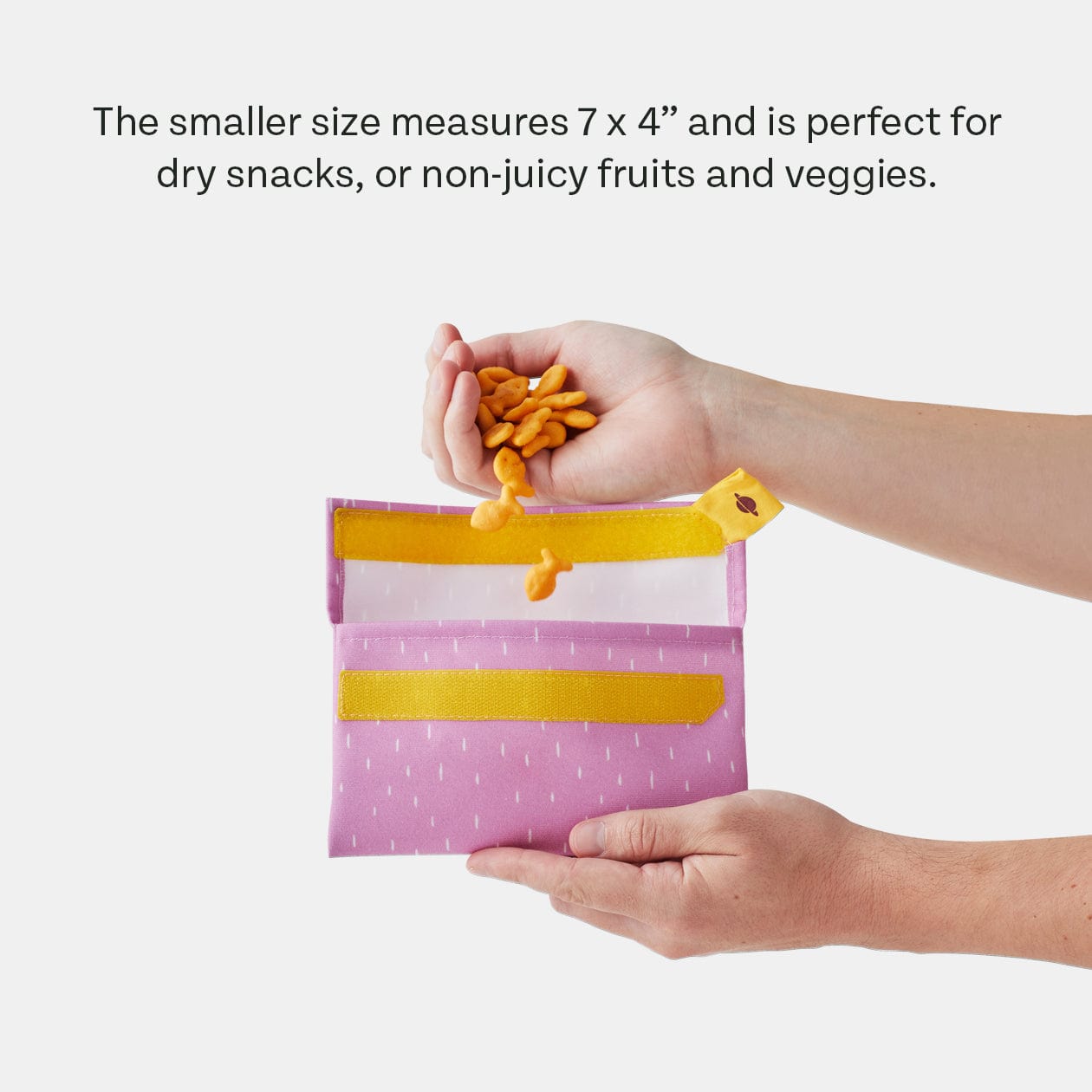 PlanetBox Snack Pack sets in Blossom and Snap Pea displayed on a table with snacks.